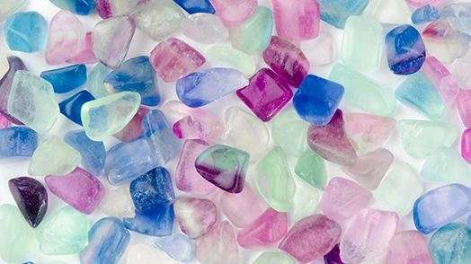 Set of colored glasses in blue, purple, light blue, pink and aqua green